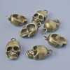 Pendentif «Crâne», diamètre 20×11×7 mm, épaisseur 5 mm, diamètre du trou 2,1 mm, conditionnement 7 pièces ±, couleur métal bronze