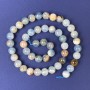 Perles de calcite, boules lisses 8 mm sur fil, longueur 39 cm+