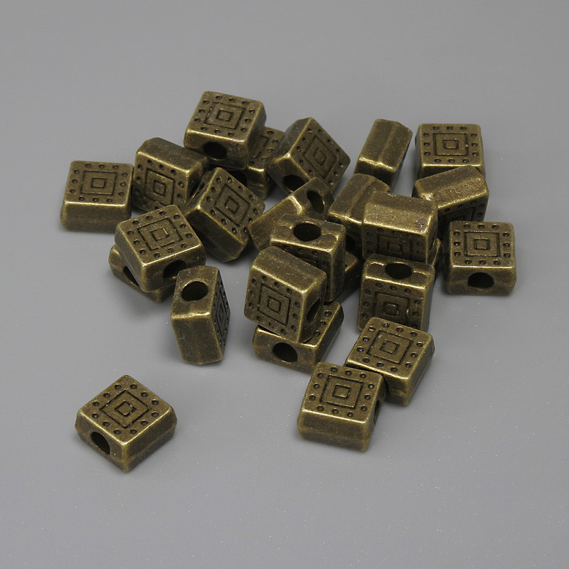 Fourniture perle-insertion couleur bronze, diamètre 6×6 mm ± ouverture d'environ 2,3 mm ± conditionnement 25 pièces