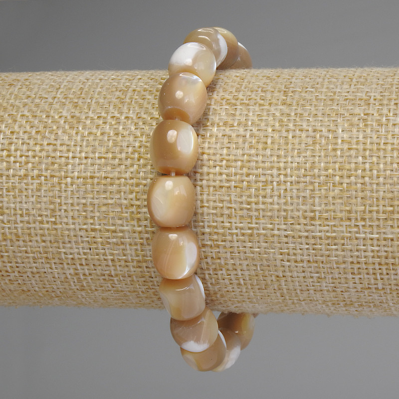Bracelet en nacre barillet, diamètre des perles 10 × 9,5 mm, longueur 18 cm, élastique