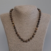 Collier œil-de-tigre, perles facettées, diamètre 8 mm, longueur environ 50 cm, avec fermoir