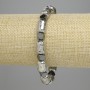 Bracelet lave et hématite, cylindres argent clair 12×8 mm ±, hématite facettée 5,5×6 mm ±, longueur 18 cm ±, élastique