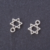 Petit pendentif Étoile de David argenté 13x9 mm, conditionnement 20 g ± 45 pièces