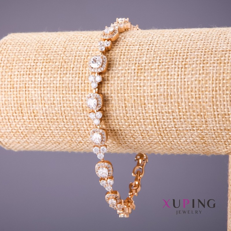 Bracelet Xuping avec pierres blanches, longueur 17–20 cm, épaisseur 7 mm, couleur dorée