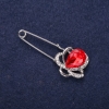 Broche-épingle « Fleur » avec strass blancs et pierre rouge, 46 × 19 mm, métal argenté