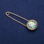 Broche-épingle avec cabochon en haliotis 23×75 mm, métal doré