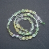 Perles sur fil assorties (améthyste, citrine et préhnite), facettées, diamètre 8x6 mm, longueur 39 cm +