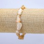 Bracelet élastique en nacre naturelle beige. Perles nacrées facettées, diamètre environ 15 × 12 mm, longueur 18 cm (+/-)