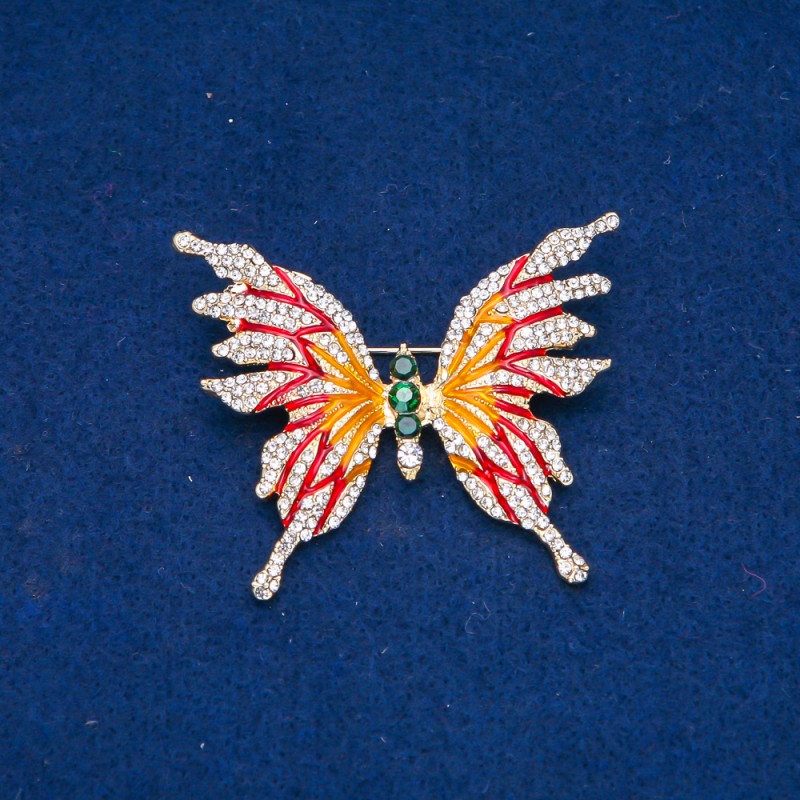 Broche papillon en métal doré, émail et strass blancs et verts 42 × 50 mm +