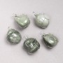 Pendentif en sérafinite naturel dans un tissage argenté, diamètre 35 × 20 mm+