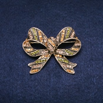 Broche Accent Nœud-papillon 55 × 45 mm, strass couleur verte et jaune, métal doré