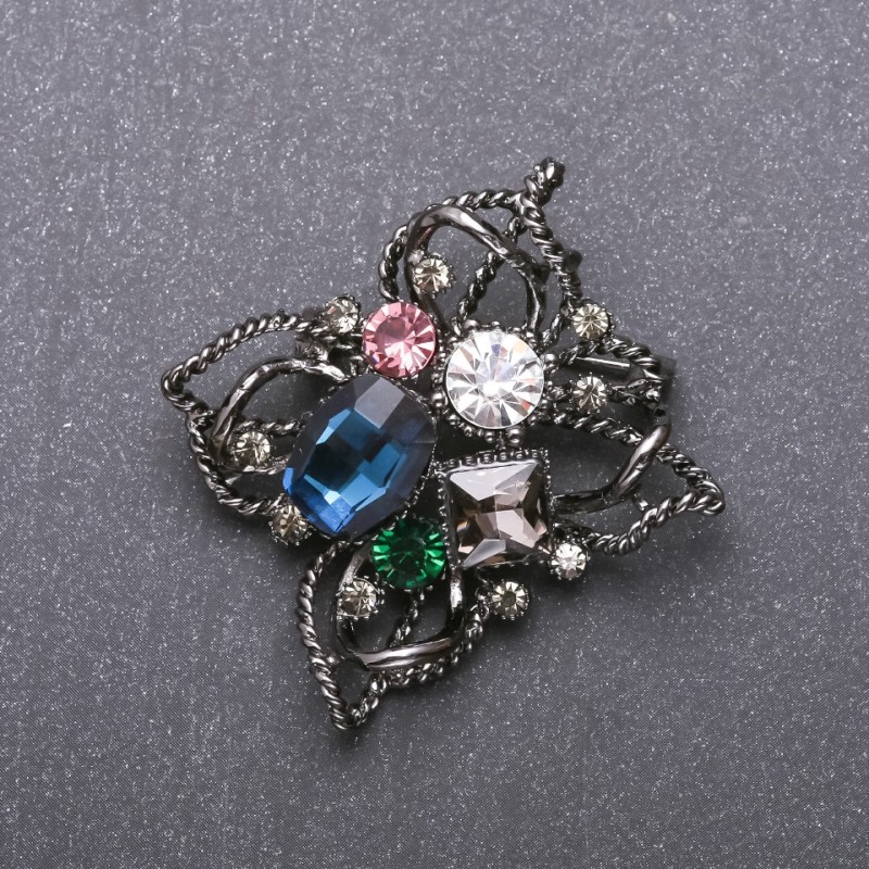 Broche « Ordre de beauté » avec cristal bleu, 51×48 mm, métal noir