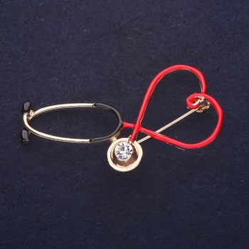 Broche en forme de stéthoscope émaillée, couleur rouge, noir et blanc, 24×25 mm, métal doré