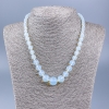 Collier pierre de lune synthétique, boules facettées à taille croissante, diamètres 6–14 mm, longueur 48 cm